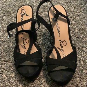 Black high heeled platform shoes